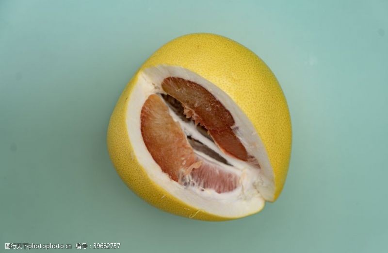 黄蜜绿底白柚子水果摄影图图片