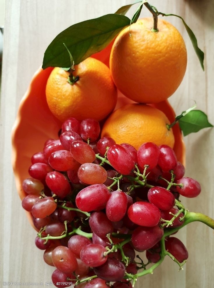 橙红水果盘图片